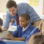 Teacher with his pupils in classroom