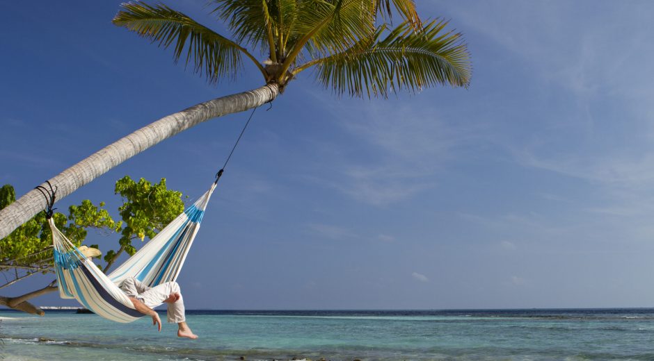 Person in hammock at a beach