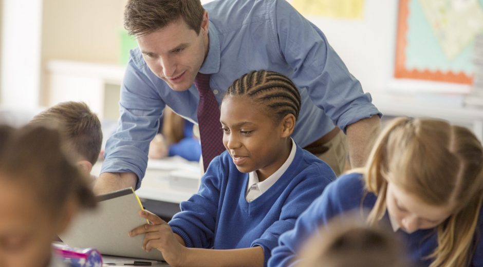 Teacher with his pupils in classroom